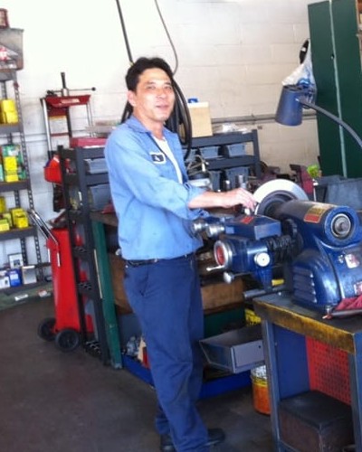 Anthony Benedicto, owner of Manila Brakes & Auto Repair Inc., working at the brake lathe inside the Buena Park shop